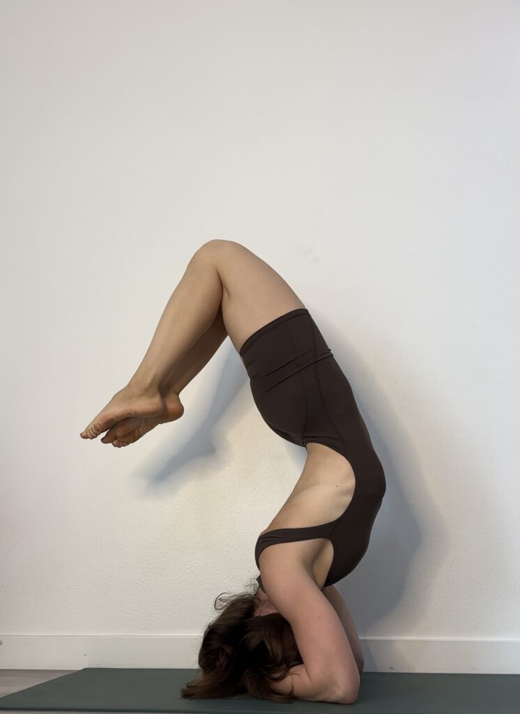 A person practicing yoga, meditation, or deep breathing in a quiet indoor at New York
