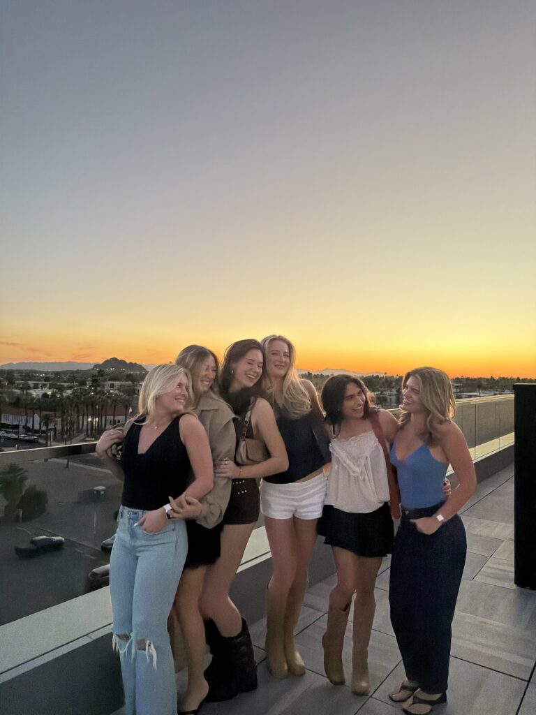 Group of friends hanging out at a rooftop bar in Brooklyn