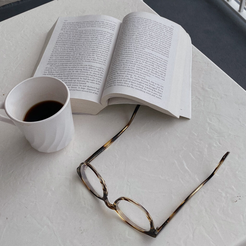 Person reading instead of scrolling through dating apps at Brooklyn