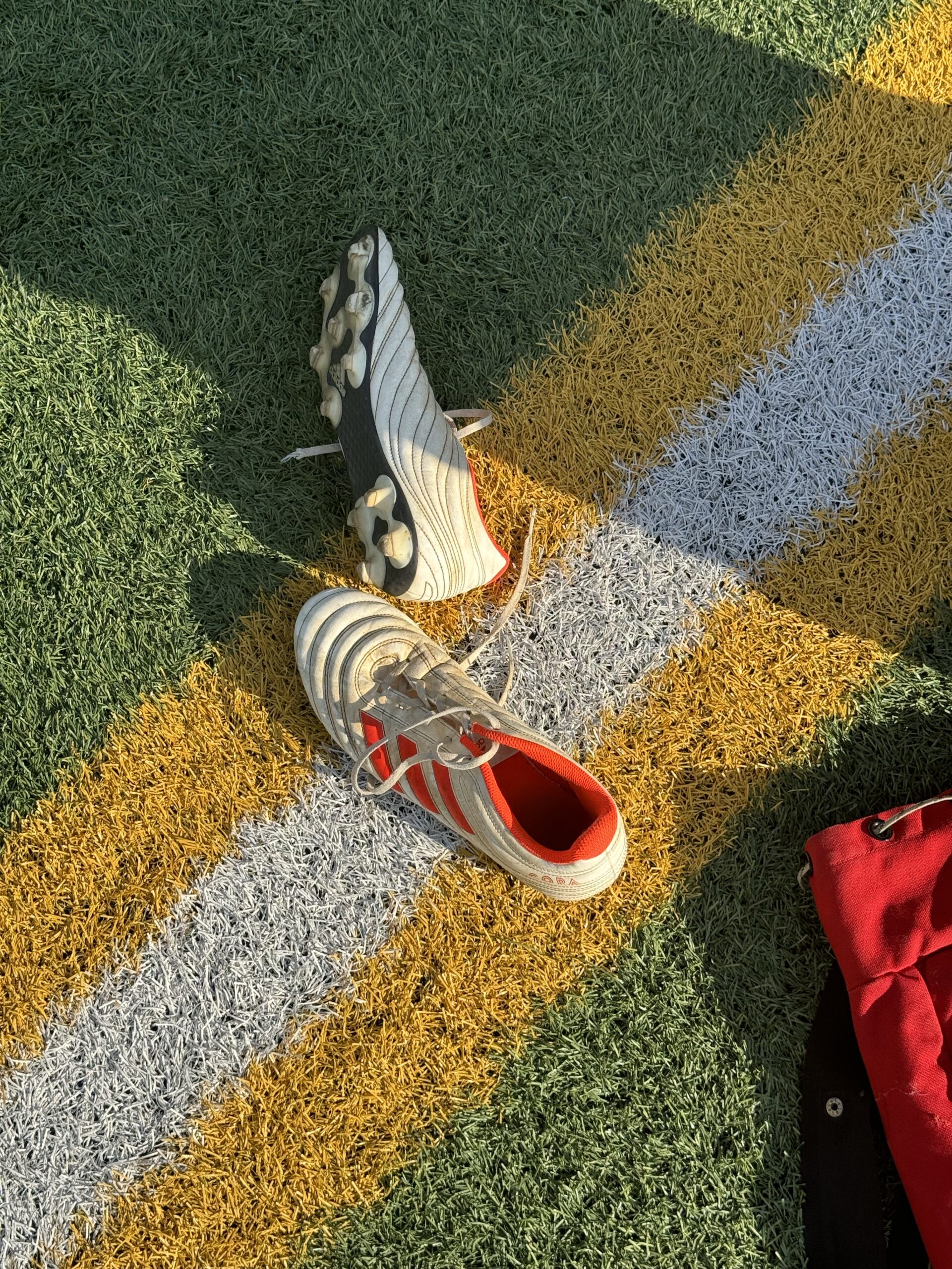 Soccer shoes lying at the sports field at New York
