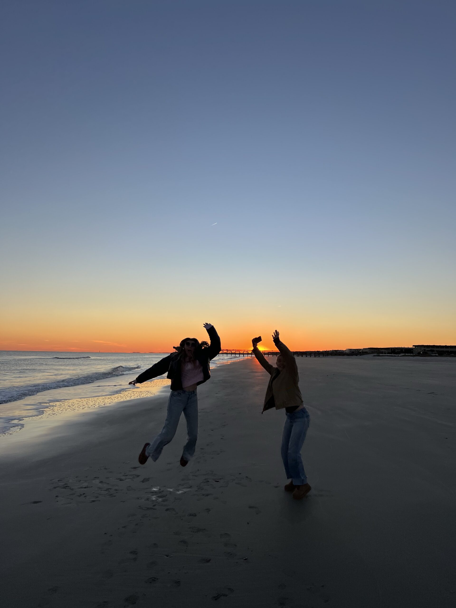 Friends enjoying their time together at the beach at Manhattan