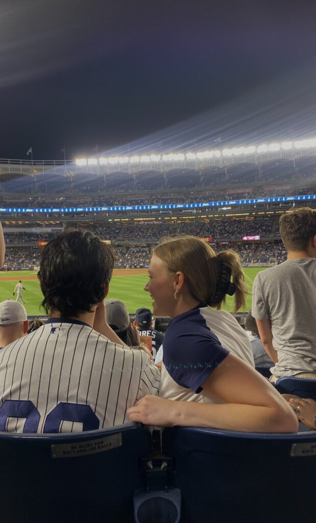 Boyfriend not entertaining her girlfriend while watching a game at Manhattan