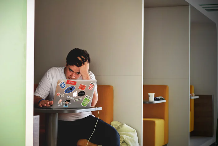 College student being homesick while working on his assignments at New York City