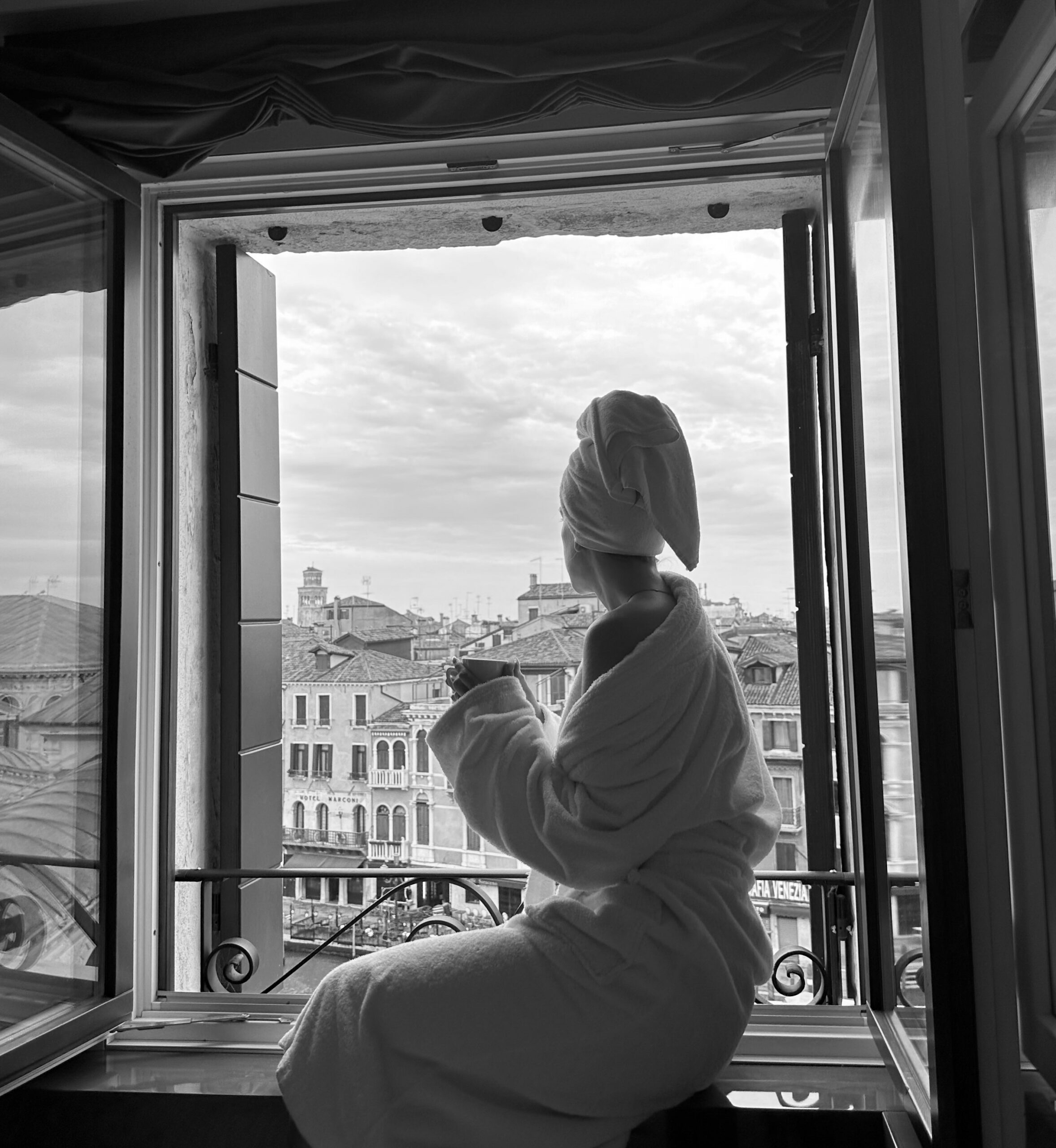 Woman looking outside thinking deeply at Manhattan